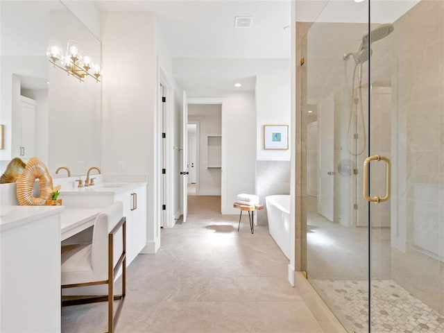 full bathroom featuring a stall shower, a freestanding bath, a sink, and double vanity