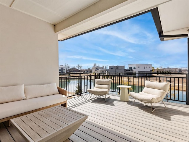 deck featuring a water view