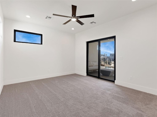 carpeted empty room with recessed lighting, visible vents, and baseboards