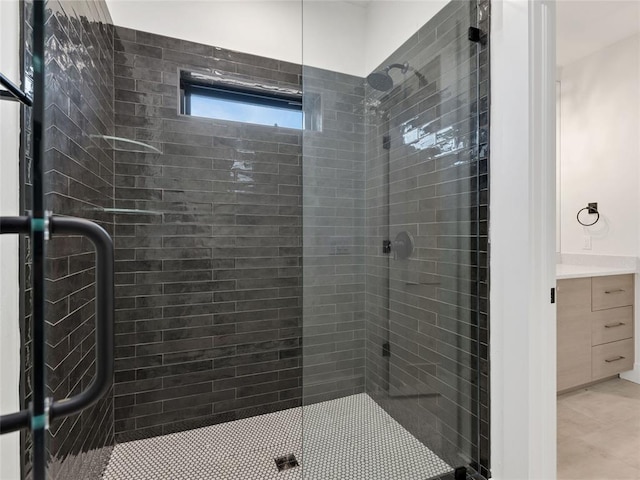 bathroom featuring a stall shower and vanity