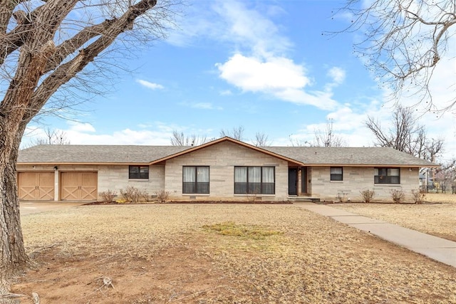 ranch-style home featuring a garage