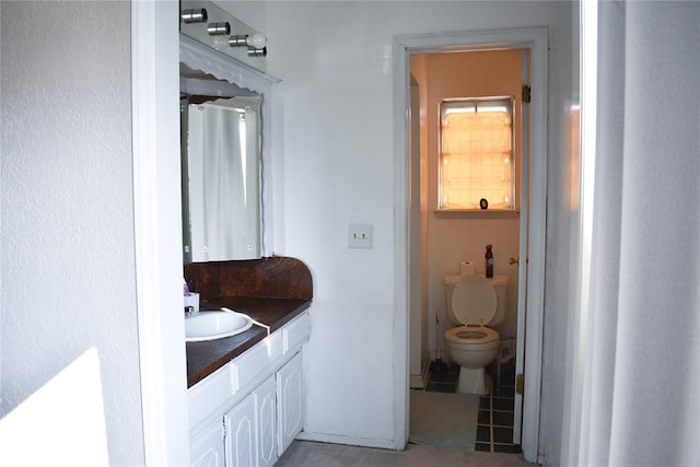 bathroom with vanity and toilet