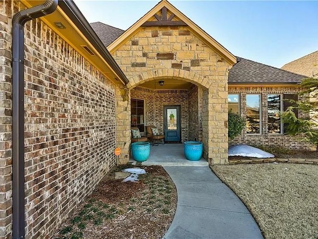 doorway to property with a patio area