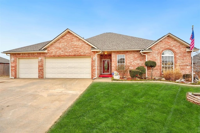 view of front of house featuring a garage and a front yard