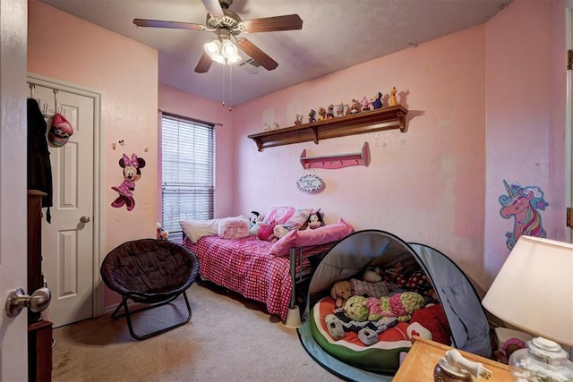 bedroom featuring ceiling fan and carpet floors