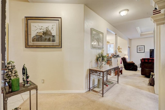 hallway with light colored carpet