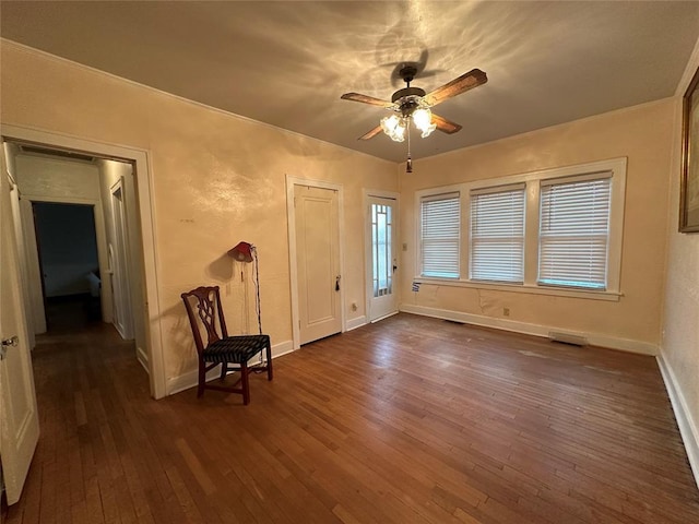 foyer entrance featuring dark hardwood / wood-style floors and ceiling fan