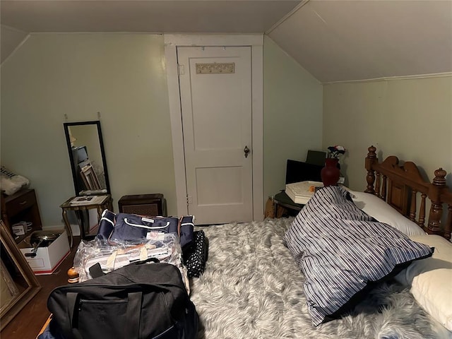 bedroom with lofted ceiling