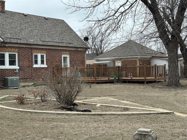 exterior space with cooling unit and a deck