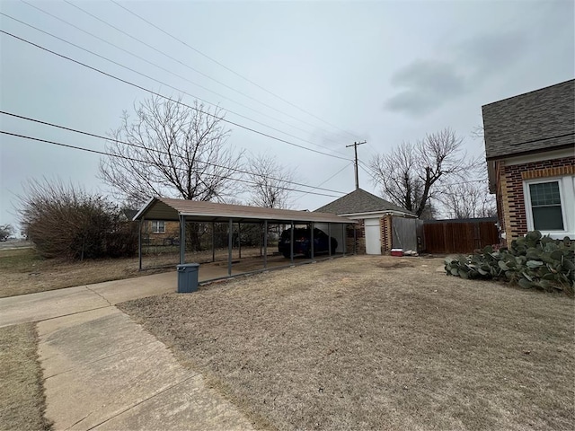 exterior space featuring a carport and a storage unit