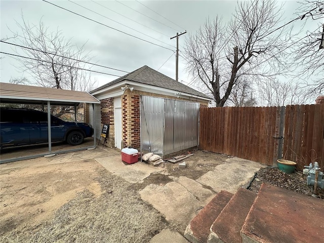 exterior space with a garage and a carport