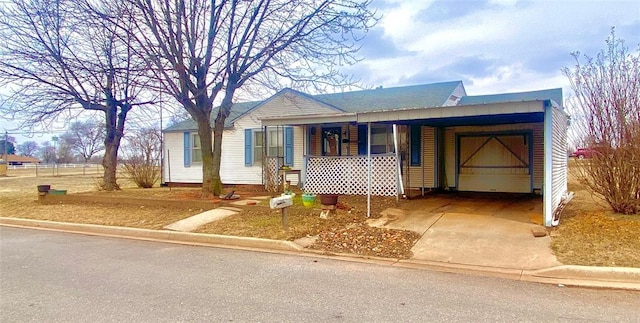 view of front of home with a carport