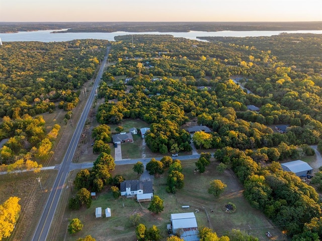 aerial view at dusk with a water view