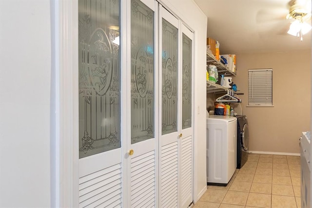 laundry room featuring light tile patterned floors, washer and dryer, and ceiling fan