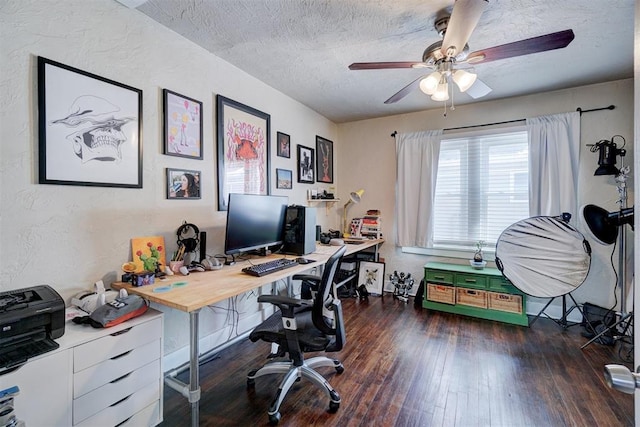 office space featuring ceiling fan, a textured ceiling, hardwood / wood-style floors, and a textured wall