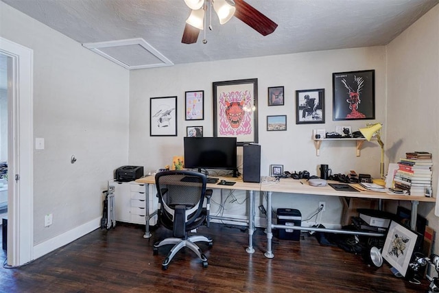 office space with wood finished floors, baseboards, attic access, ceiling fan, and a textured ceiling