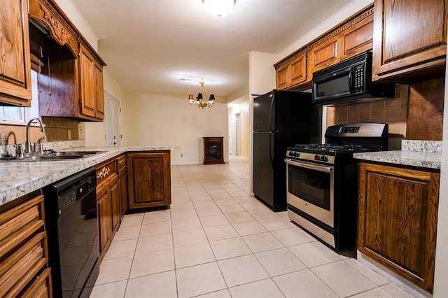 kitchen with light tile patterned flooring, sink, backsplash, a notable chandelier, and black appliances