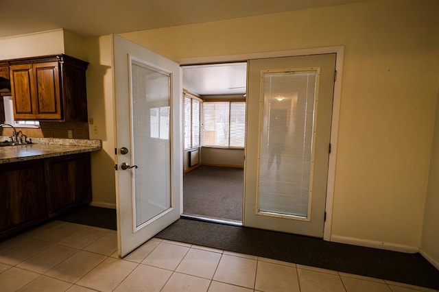 kitchen with sink and light tile patterned floors