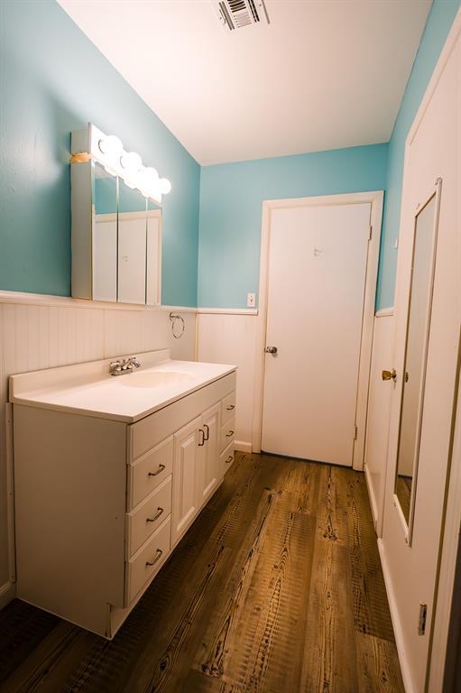 bathroom featuring vanity and wood-type flooring