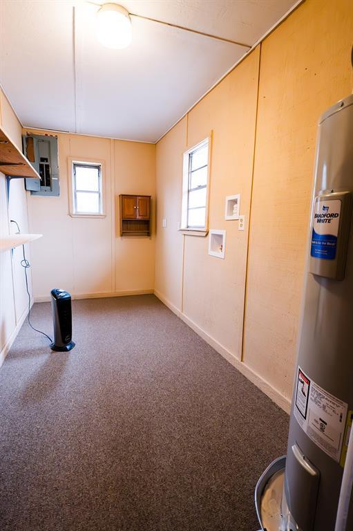 basement featuring water heater