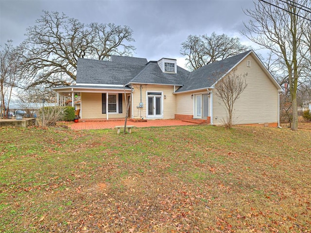 rear view of house with a yard