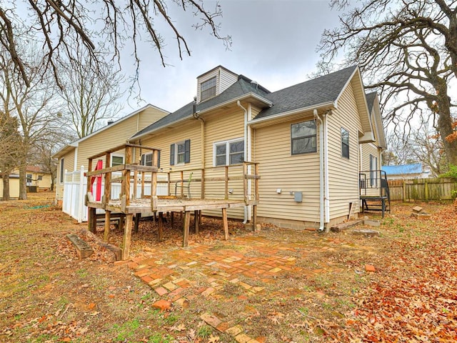 rear view of property with a deck