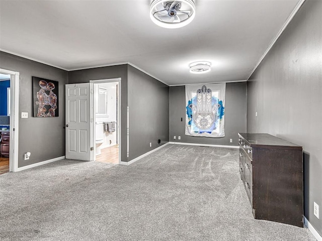 interior space with crown molding and light colored carpet