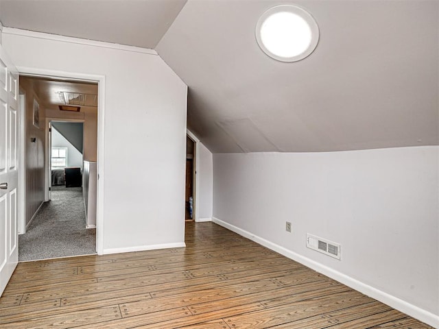 bonus room featuring lofted ceiling and hardwood / wood-style floors