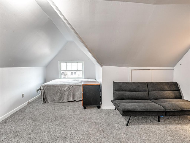 carpeted bedroom featuring vaulted ceiling