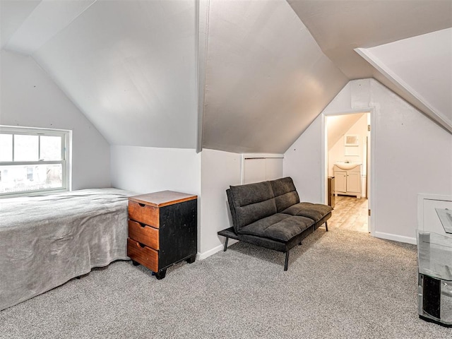 bedroom featuring lofted ceiling and carpet floors