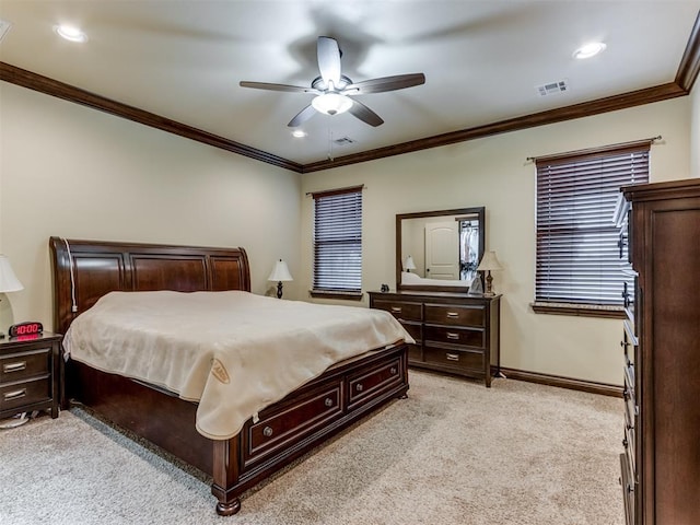 bedroom with light carpet, ornamental molding, and ceiling fan