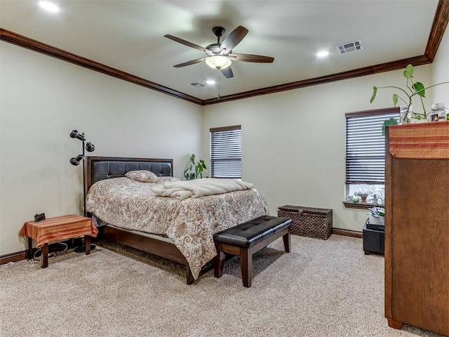 carpeted bedroom with crown molding and ceiling fan