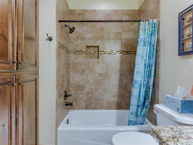 bathroom featuring shower / bath combination with curtain and toilet