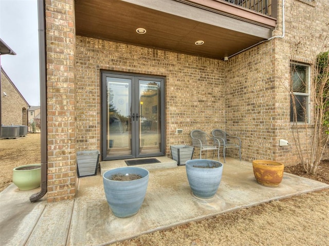 view of patio with french doors and central AC