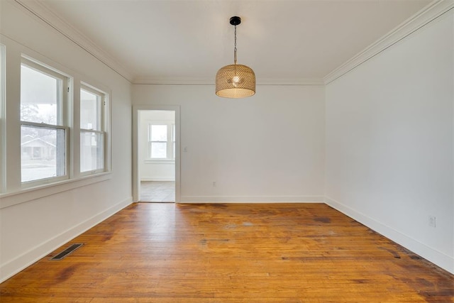 unfurnished dining area with crown molding and light wood-type flooring