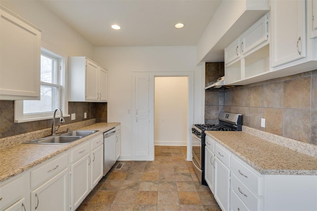 kitchen featuring tasteful backsplash, appliances with stainless steel finishes, sink, and white cabinets