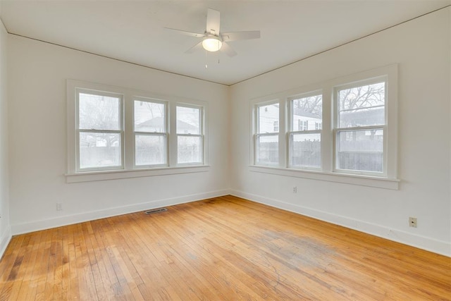 empty room featuring light hardwood / wood-style floors and ceiling fan