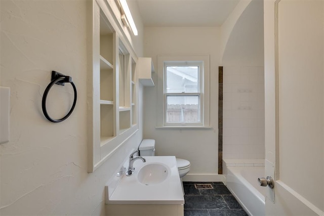 full bathroom with vanity, bathing tub / shower combination, and toilet