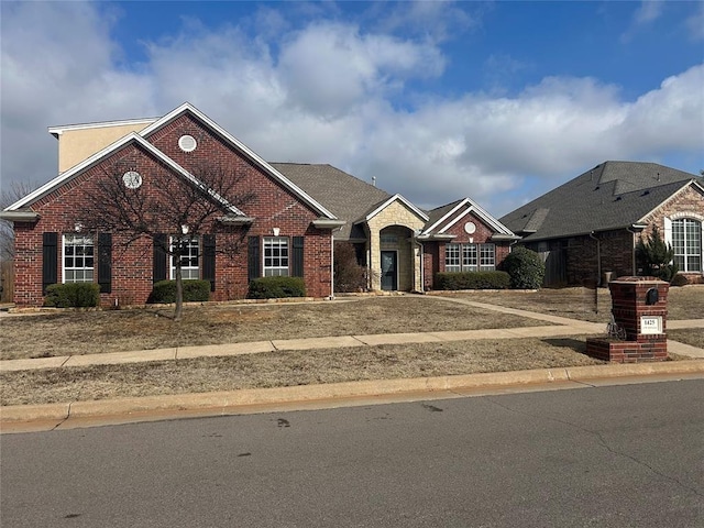 view of front of house with brick siding