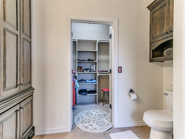 bathroom featuring tile patterned floors and toilet