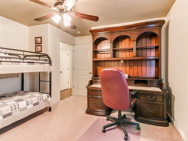 office area featuring light colored carpet and ceiling fan