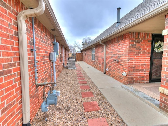 view of side of property featuring central AC unit