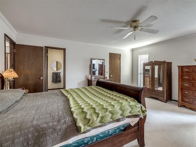 bedroom featuring ornamental molding, light carpet, ceiling fan, and a textured ceiling