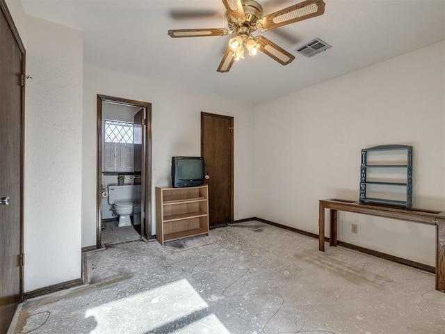 bedroom with visible vents, ceiling fan, baseboards, and ensuite bathroom