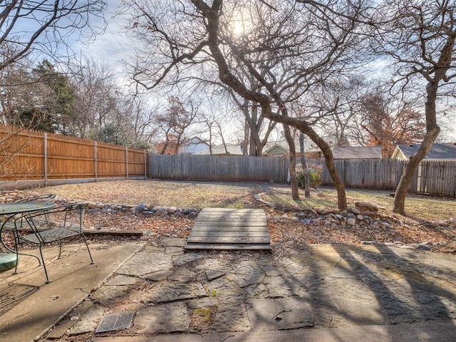 view of yard featuring a fenced backyard and a patio