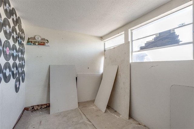 21731 E Fifth St, Hinton, OK 73047 - bathroom with concrete flooring and a textured ceiling