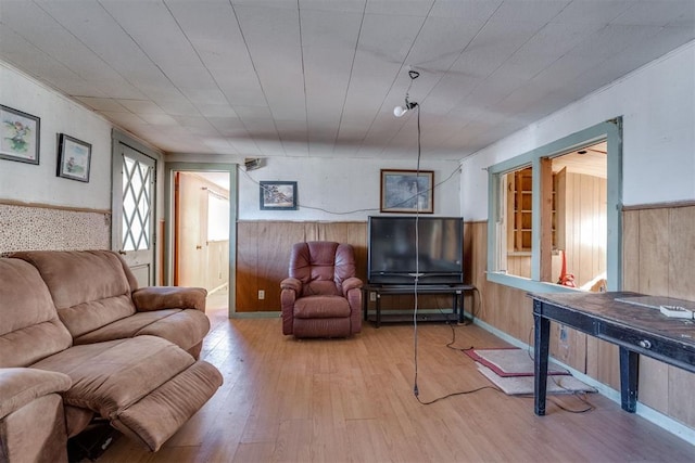 21731 E Fifth St, Hinton, OK 73047 - living room featuring wooden walls and light hardwood / wood-style floors