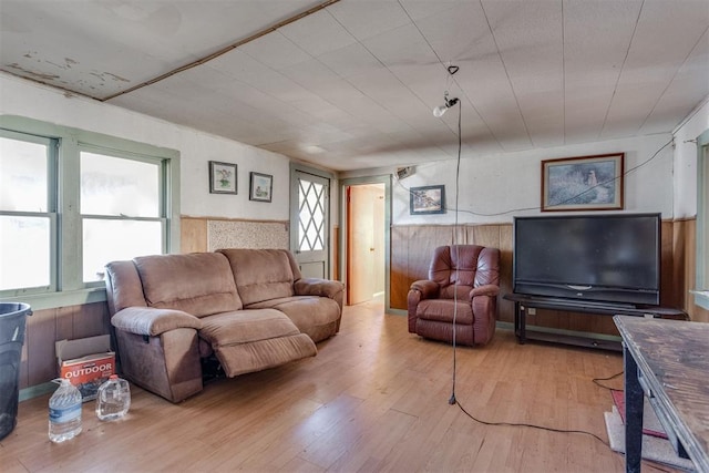 21731 E Fifth St, Hinton, OK 73047 - living room featuring hardwood / wood-style floors and wooden walls