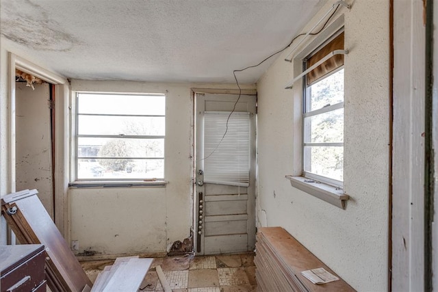 21731 E Fifth St, Hinton, OK 73047 - interior space with a healthy amount of sunlight and a textured ceiling