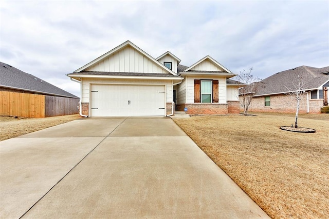 view of front of property with a garage and a front yard